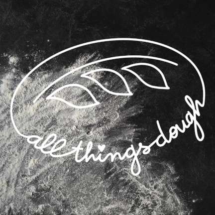 All Things Dough logo showing the handwritten name, inside a bread shape